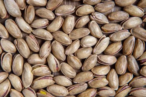 Background of pistachio nuts. Flat layout. Stock Photos