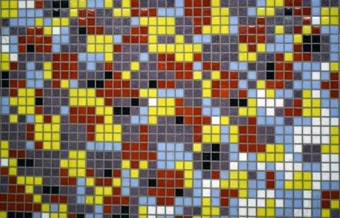 Background as pixels of a multicolored mosaic. Wall with colored ceramic tile Stock Photos