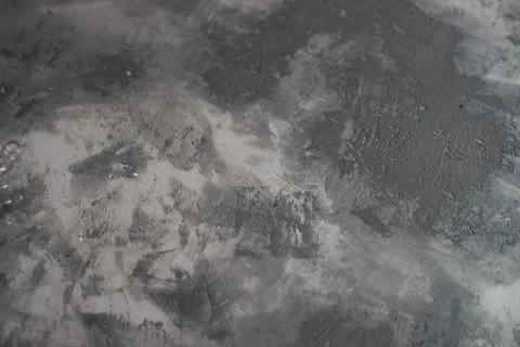 Background from plaster decorated with artificial concrete. Drying plaster on Stock Photos