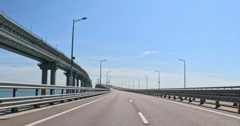 Background plate of view of the bridge through the rear window of a car. Video stock 297769823