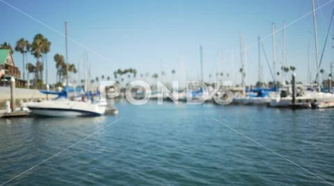 Background plate of Water in the marina with incidental people on a sailing b Stock Photos
