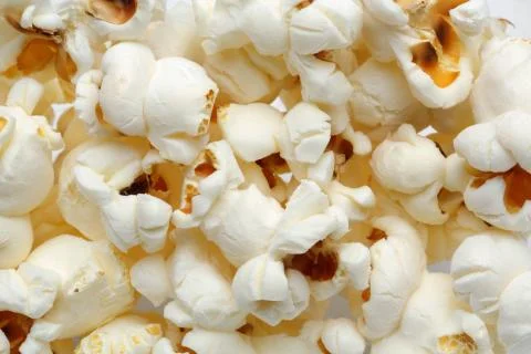 Background of popcorn, top view macro Stock Photos