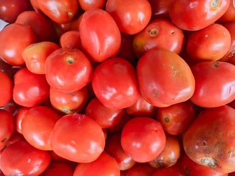 Background portrait of tomato vegetable fruit at a fruit vendor Stock Photos