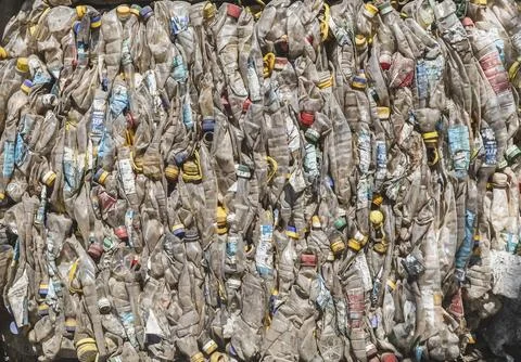 Background of pressed plastic bottles to be recycled Stock Photos