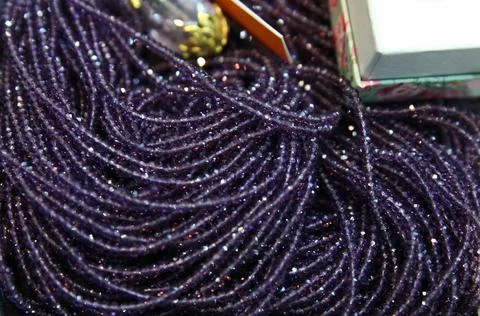 Background of purple beads close-up Stock Photos
