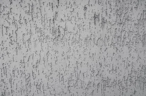 The background of the raised white wall is finished with decorative plaster Stock Photos