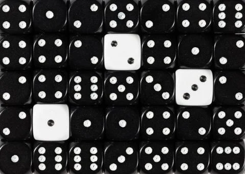 Background of random ordered black dices with three white cubes Stock Photos