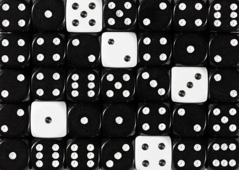 Background of random ordered black dices with five white cubes Stock Photos