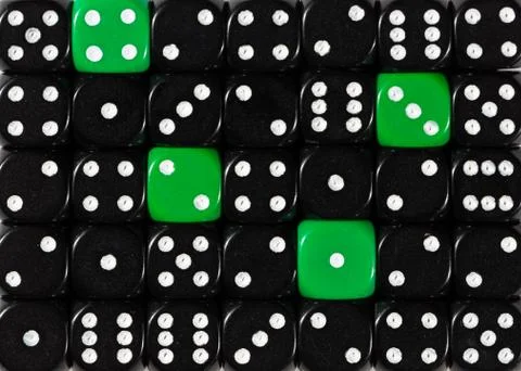 Background of random ordered black dices with four green cubes Stock Photos