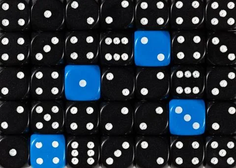 Background of random ordered black dices with four blue cubes Stock Photos