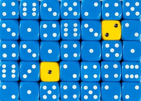 Background of random ordered blue dices with two yellow cubes Stock Photos