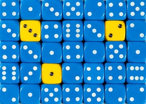 Background of random ordered blue dices with three yellow cubes Stock Photos