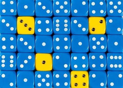 Background of random ordered blue dices with four yellow cubes Stock Photos