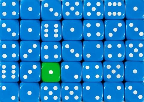Background of random ordered blue dices with one green cube Stock Photos