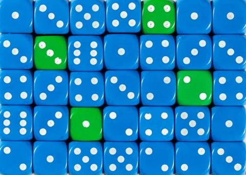 Background of random ordered blue dices with four green cubes Stock Photos