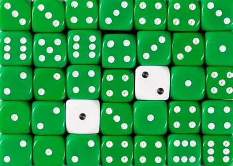 Background of random ordered green dices with two white cubes Stock Photos