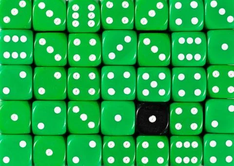 Background of random ordered green dices with one black cube Stock Photos