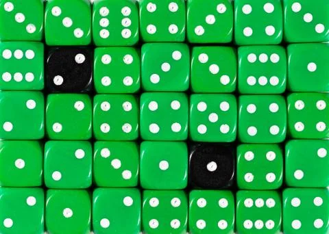 Background of random ordered green dices with two black cubes Stock Photos