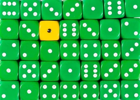 Background of random ordered green dices with one yellow cube Stock Photos