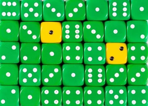 Background of random ordered green dices with two yellow cubes Stock Photos