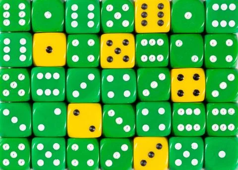 Background of random ordered green dices with six yellow cubes Stock Photos