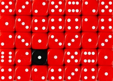 Background of random ordered red dices with one black cube Stock Photos