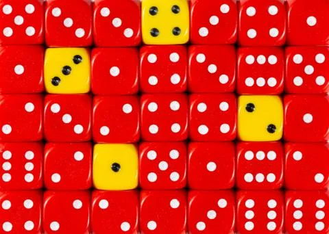 Background of random ordered red dices with four yellow cubes Stock Photos