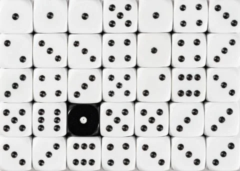 Background of random ordered white dices with one black cube Stock Photos