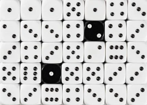 Background of random ordered white dices with two black cubes Stock Photos