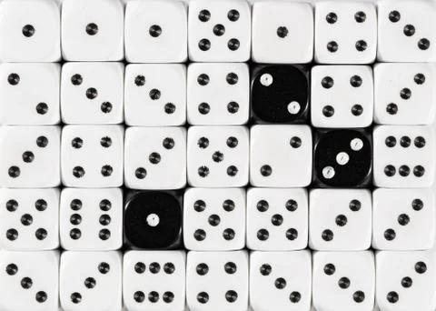 Background of random ordered white dices with three black cubes Stock Photos