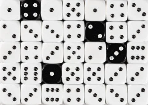 Background of random ordered white dices with four black cubes Stock Photos
