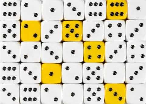 Background of random ordered white dices with six yellow cubes Stock Photos