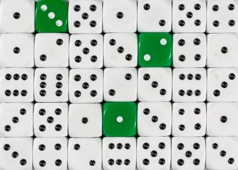 Background of random ordered white dices with three green cubes Stock Photos