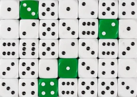Background of random ordered white dices with four green cubes Stock Photos