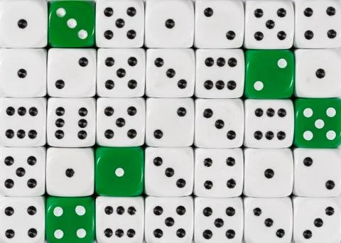 Background of random ordered white dices with five green cubes Stock Photos