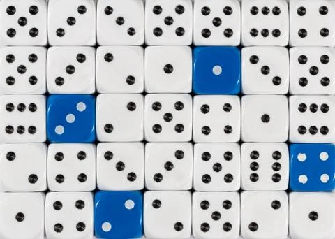 Background of random ordered white dices with four blue cubes Stock Photos