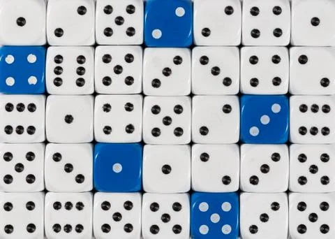 Background of random ordered white dices with five blue cubes Stock Photos