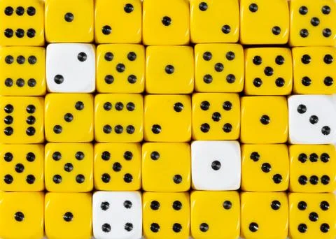 Background of random ordered yellow dices with four white cubes Stock Photos