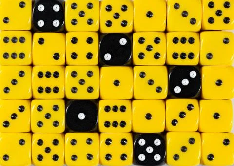 Background of random ordered yellow dices with five black cubes Stock Photos