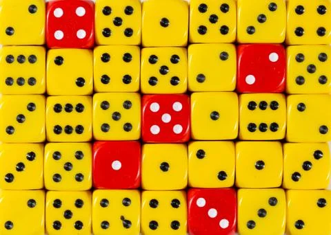 Background of random ordered yellow dices with five red cubes Stock Photos