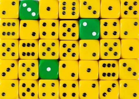 Background of random ordered yellow dices with three green cubes Stock Photos