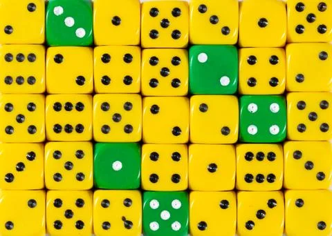Background of random ordered yellow dices with five green cubes Stock Photos