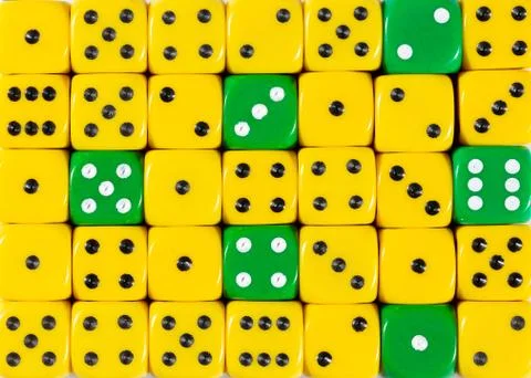 Background of random ordered yellow dices with six green cubes Stock Photos
