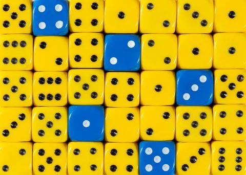 Background of random ordered yellow dices with five blue cubes Stock Photos