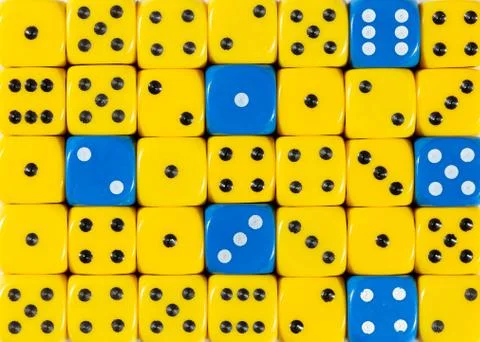 Background of random ordered yellow dices with six blue cubes Stock Photos