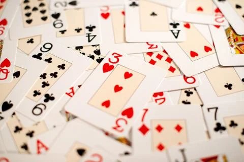 Background of a random spread of playing cards Stock Photos