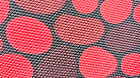 Background with a red and white dots pattern., isolated textured background Foto stock