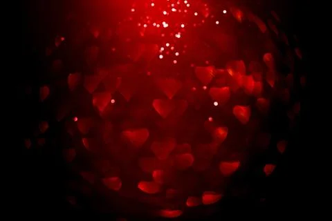 Background with red bokeh in the shape of a heart. Stock Photos