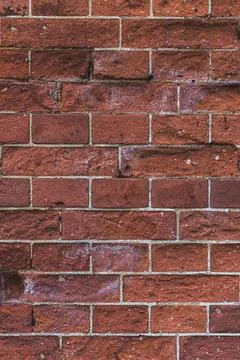 The background is a red brick. Brick wall background. The red brick wall Stock Photos