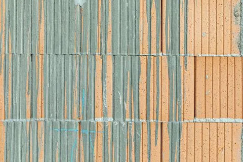 Background of red brick with dried flowing concrete pattern Stock Photos